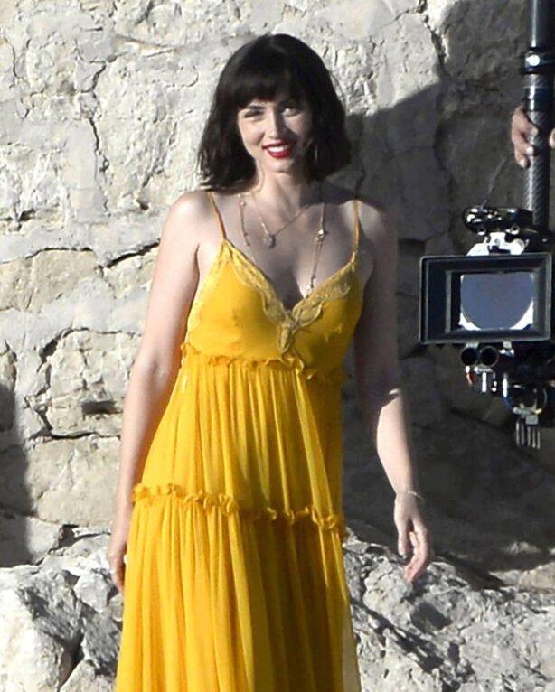 Ana de Armas - In a yellow maxi dress during the filming of an advertisement in Mallorca
