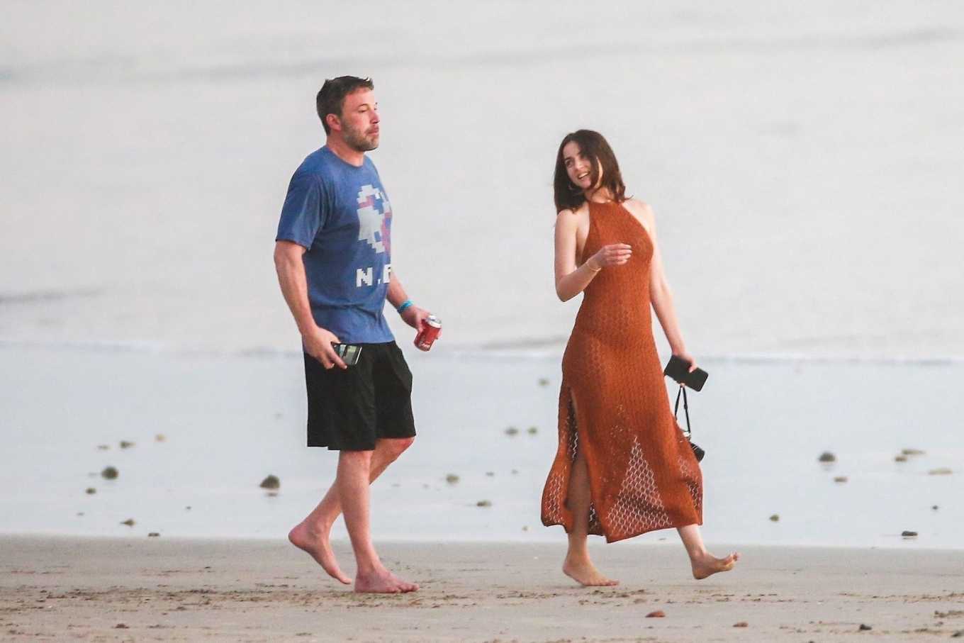 Ana De Armas - Stroll in red dress on the beach in Costa Rica-12 | GotCeleb