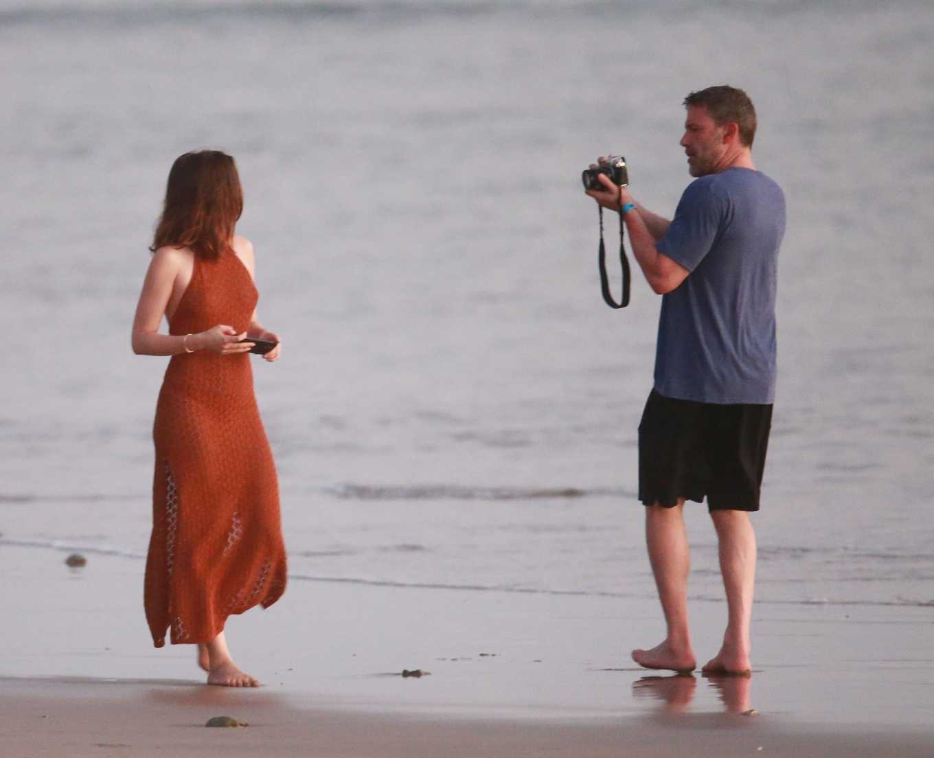 Ana De Armas - Stroll in red dress on the beach in Costa Rica-21 | GotCeleb