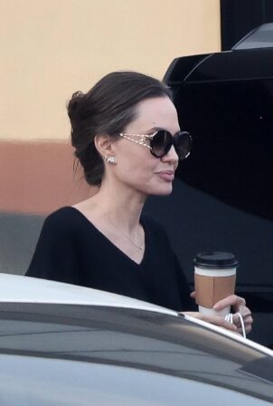 Angelina Jolie - In an all-black ensemble as she picks up food to go in Los Feliz