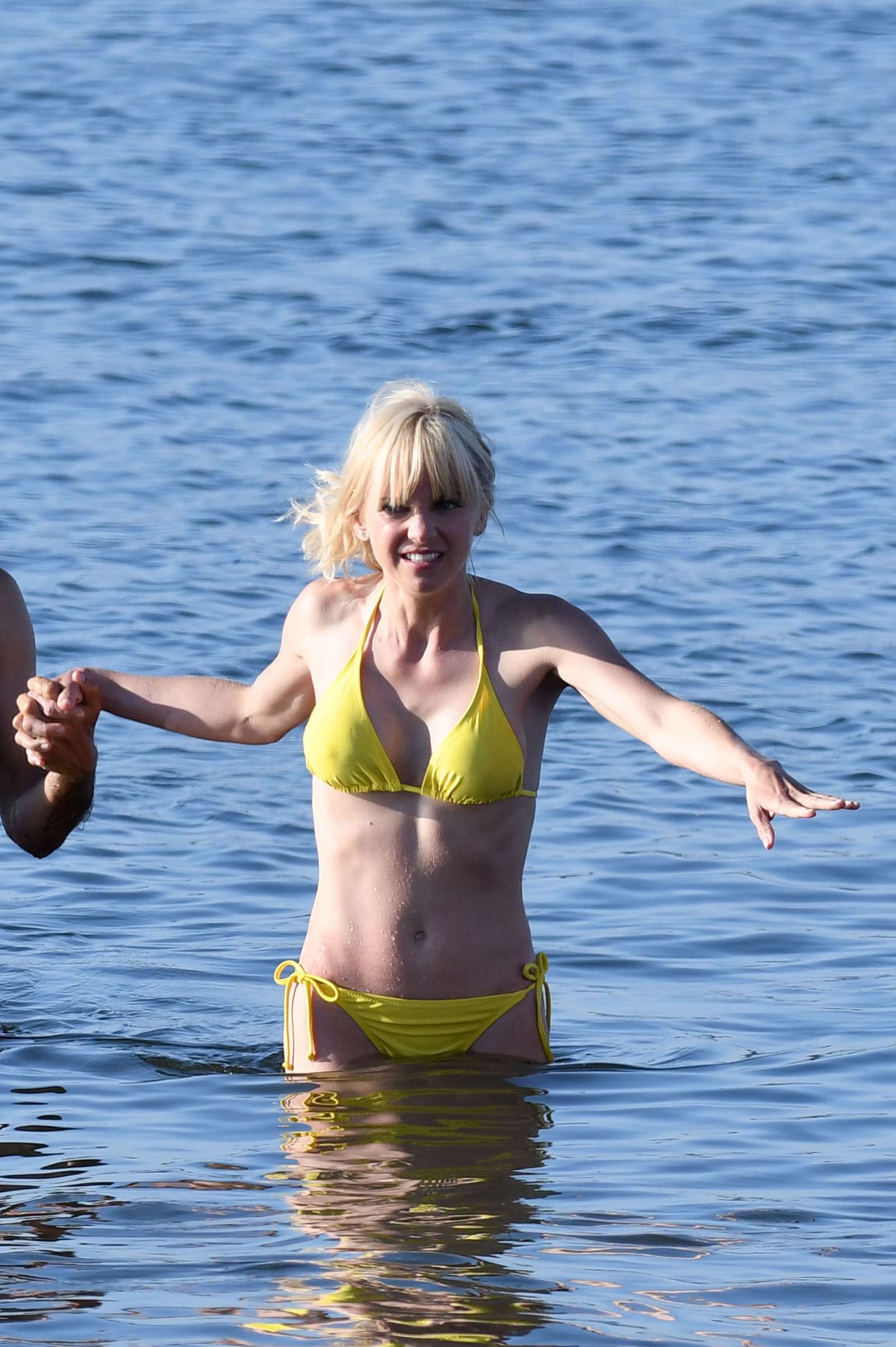 Anna Faris in Yellow Bikini On the set of 'Overboard' in Vancouve...