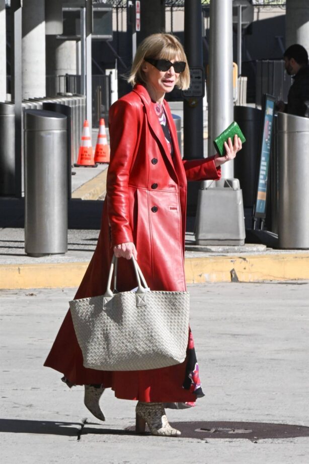 Anna Wintour - In red leather coat and snakeskin boots seen at JFK Airport