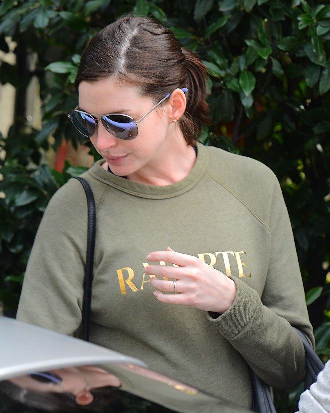 Anne Hathaway and Adam Schulman Leave an Office in LA