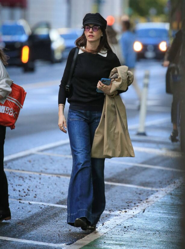 Anne Hathaway - Heads to the Langham building on Central Park West in New York