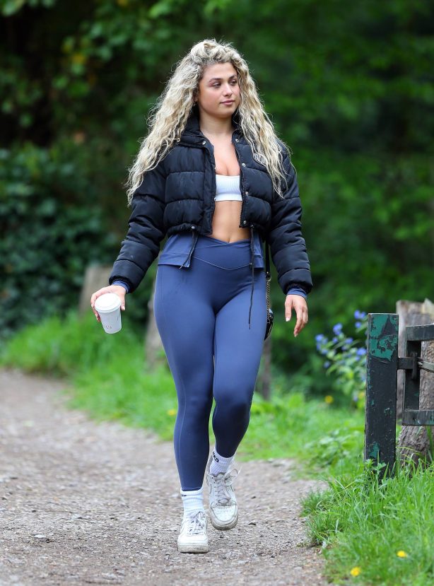Antigoni Buxton - In a white sports bra and blue leggings out in London