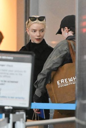 Anya Taylor-Joy - Is pictured going through security at JFK Airport in New York