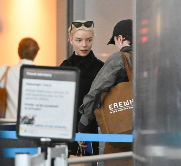Anya Taylor-Joy - Is pictured going through security at JFK Airport in New York