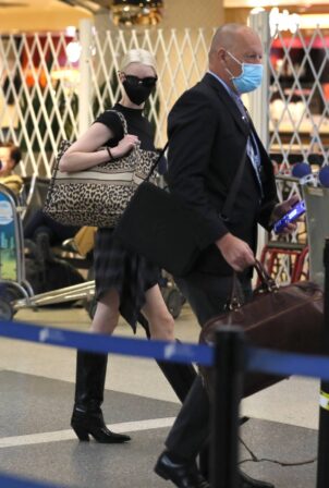 Anya Taylor-Joy - Spotted at LAX in a dress and knee-high boots