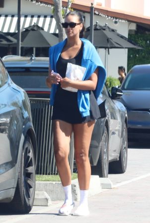 April Love Geary - Wearing a black mini dress while she is out shopping in Malibu