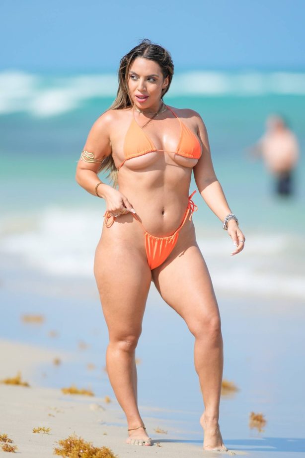 Ara Queen Bae - In a bright orange bikini at the beach in Miami Beach