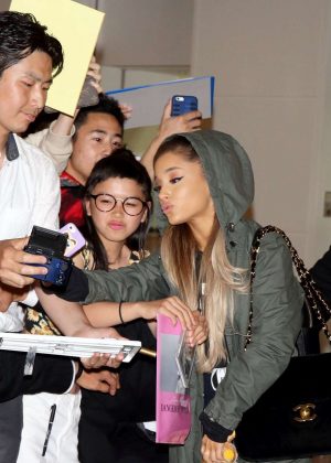 Ariana Grande is seen upon arrival at Haneda Airport on June 13