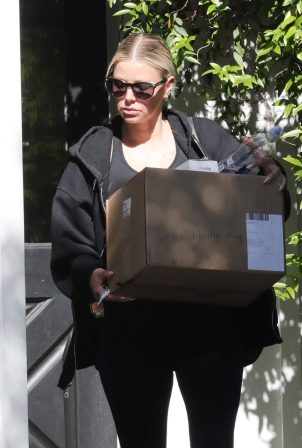 Ariana Madix - Seen carrying a boxes while heading outside in Los Angeles