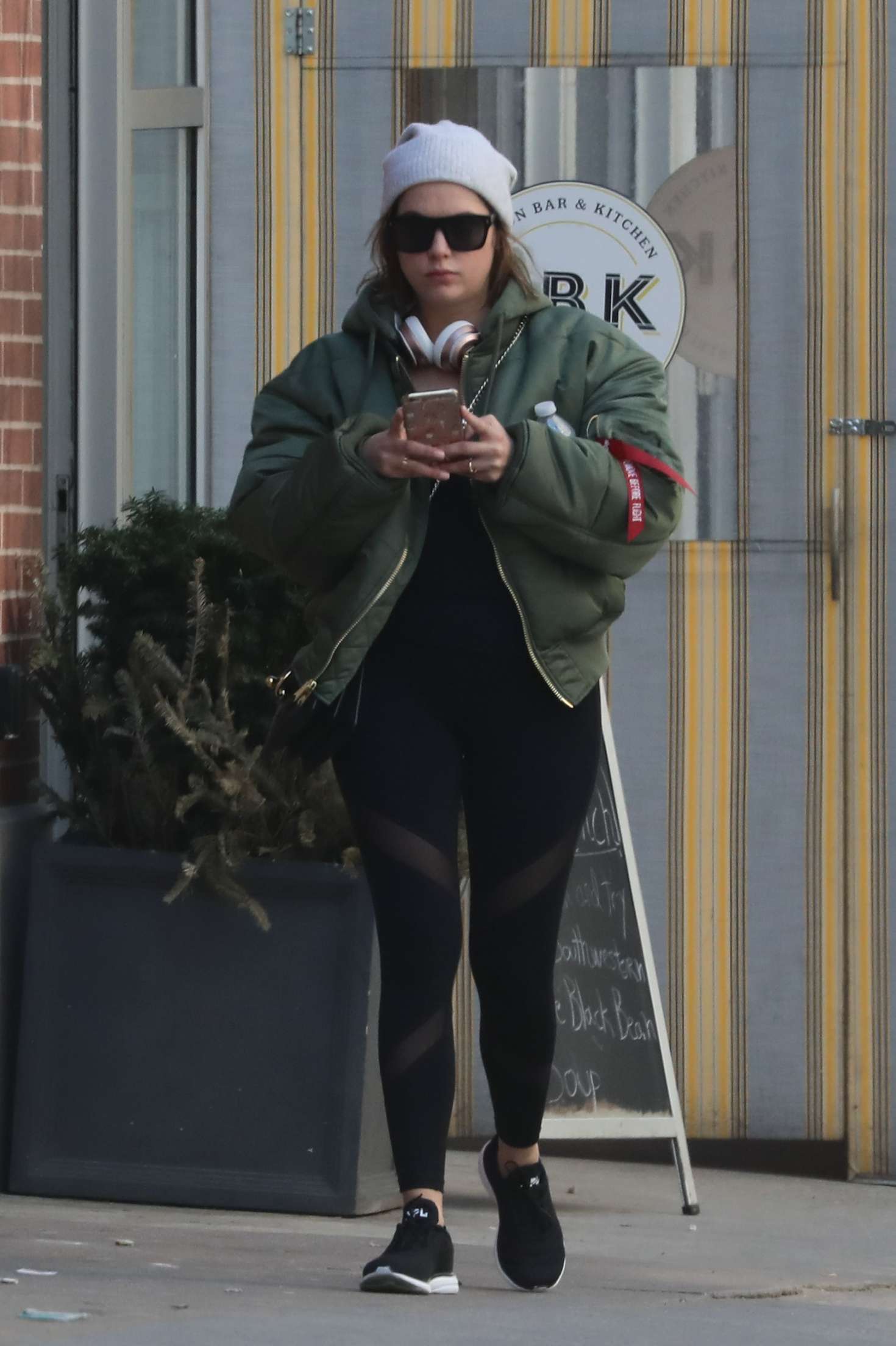 Ashley Benson in black tights out in NY