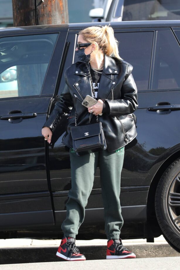Ashley Benson - In green sweatpants and a black leather jacket shopping in West Hollywood