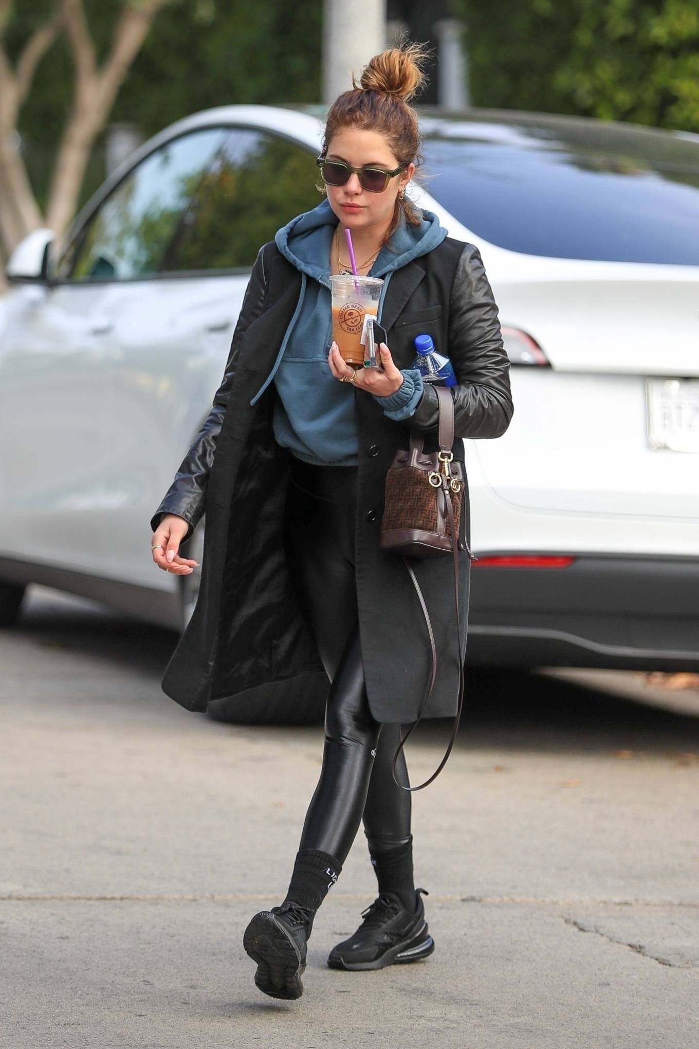 Ashley Benson - In long coat and mini Fendi tote in West Hollywood