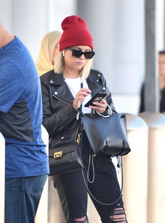 Ashley Benson - Waiting for her car at the LAX airport in Los Angeles