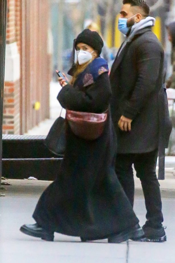 Ashley Olsen - Out in a maxi black coat at her office building in Tribeca