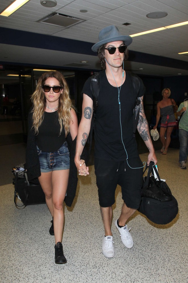 Ashley Tisdale and husband Christopher French at LAX Airport in LA