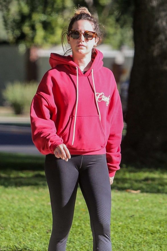 Ashley Tisdale in a red hoodie and black leggings for a walk in Los Feliz