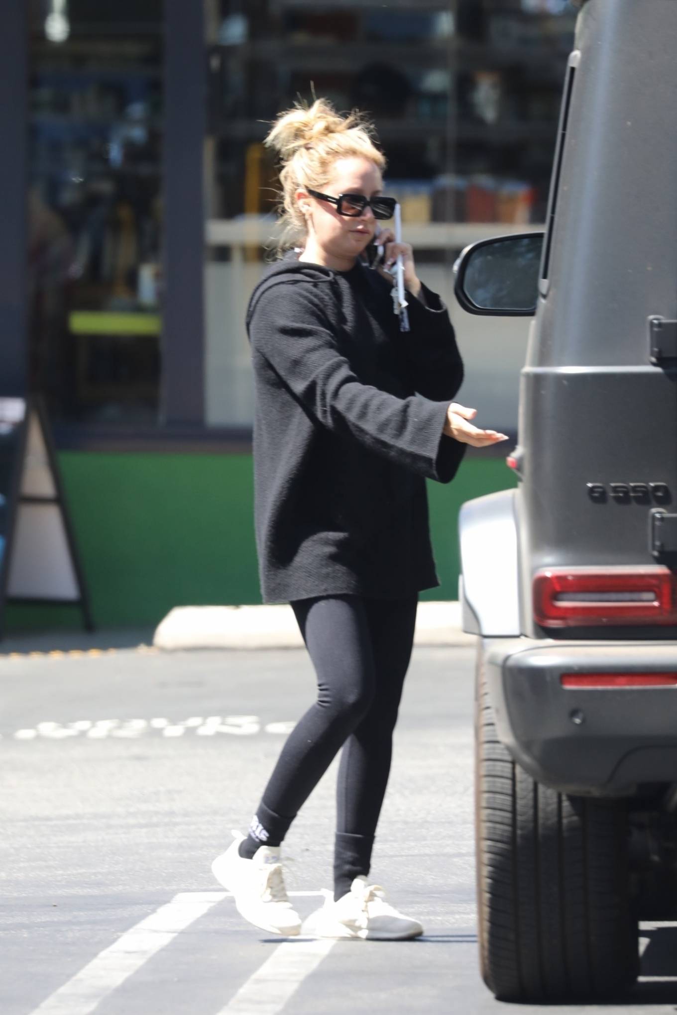 Ashley Tisdale - keeps it cozy in all-black loungewear at Erewhon in West Hollywod