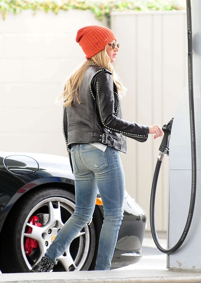 Ashley Tisdale in Jeans Pumping gas in Toluca Lake
