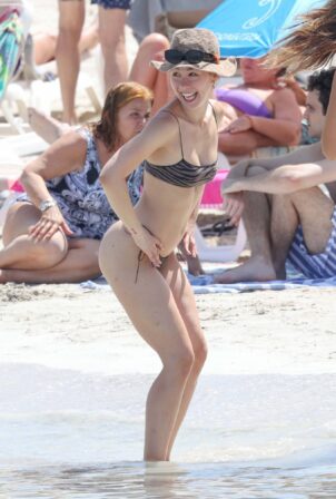 Aurora Ramazzotti - In a black bikini on holiday on the beach in Formentera