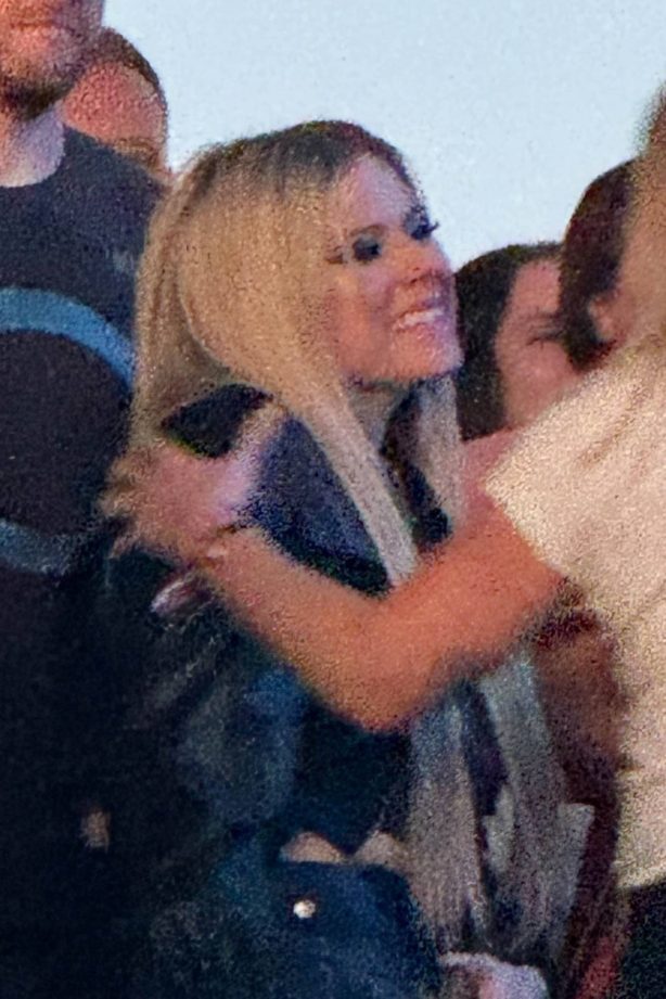 Avril Lavigne - Spotted with a new mystery man at the When We Were Young Festival in LA