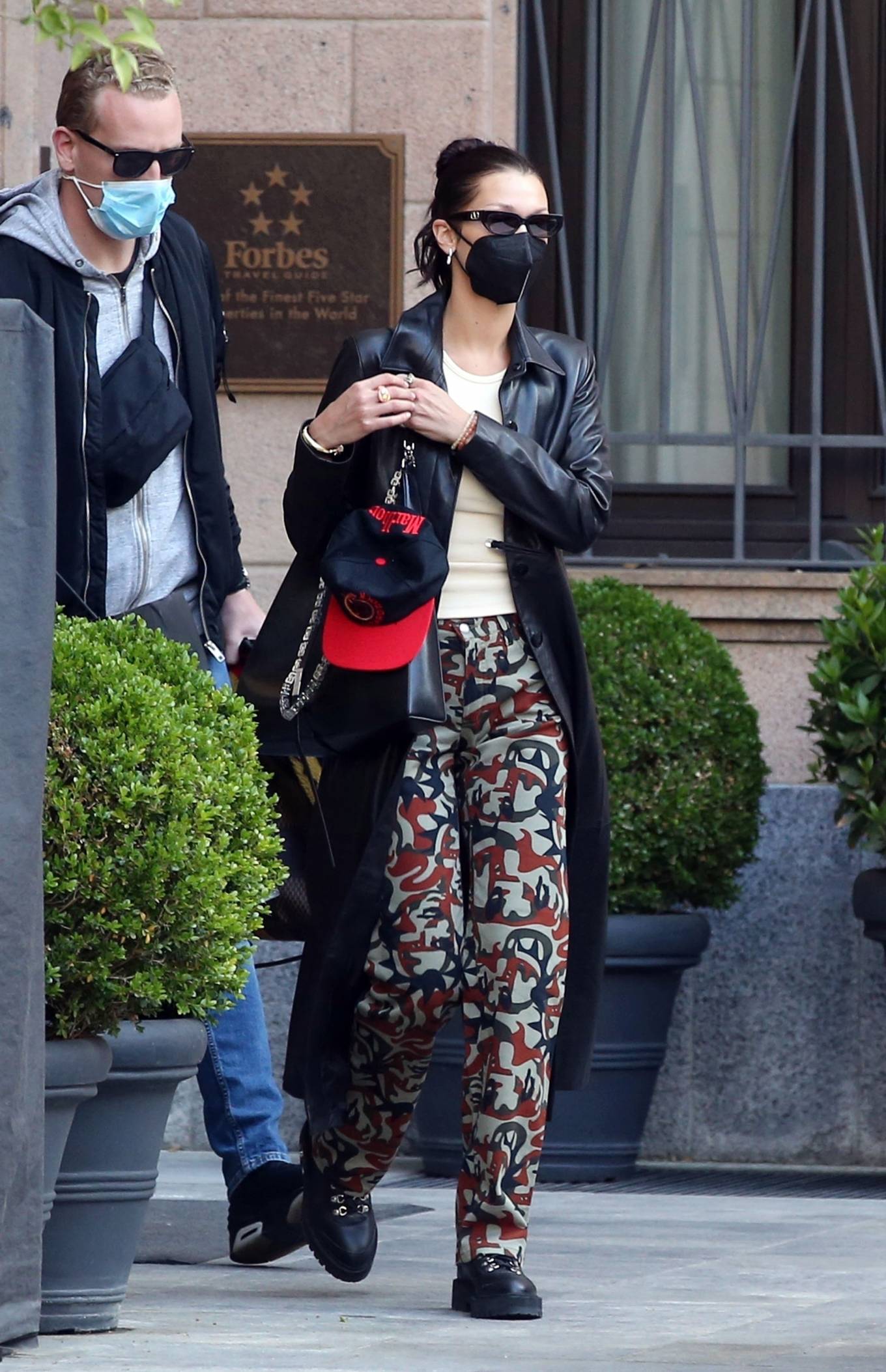 Bella Hadid - Pictured with her bodyguard while leaving her hotel and ...