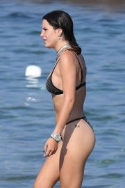 Bella Thorne - In black bikini on the beach in Sardinia
