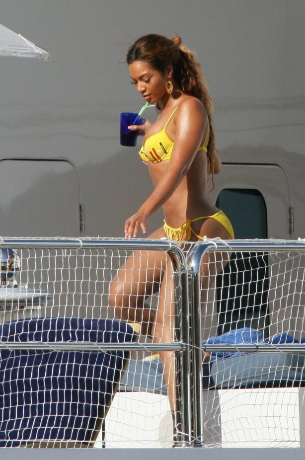 Beyonce Knowles - In a yellow bikini on her yacht in the harbor of the Principality of Monaco