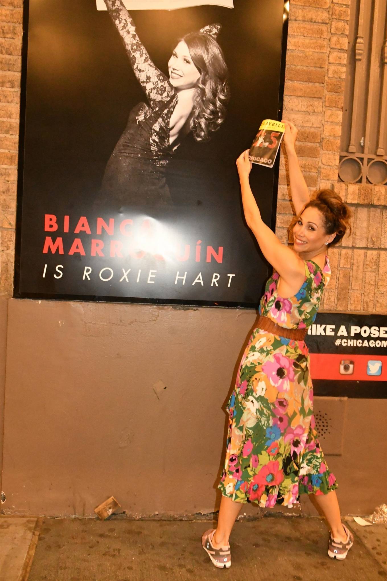 Bianca Marroquin - Poses next to her Chicago poster in New York