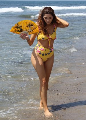 Blanca Blanco in Yellow Swimsuit on the beach in Malibu