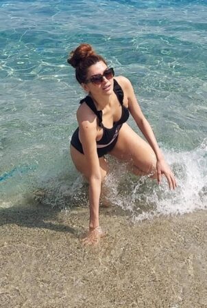 Blanca Blanco - Posing while wearing a 'No Photos' black swimsuit while vacationing in Sicily