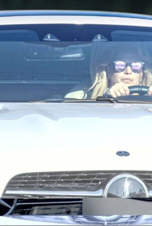 Britney Spears - Seen driving her sportscar with boyfriend Sam Asghari in Westgate