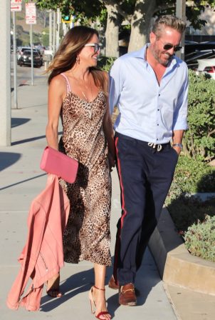 Brooke Burke - Rocks in an animal print dress with her fiancee Scott Rigsby at Nobu in Malibu