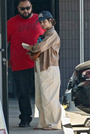Camila Cabello - In oversized pants and a crop top out in West Hollywood