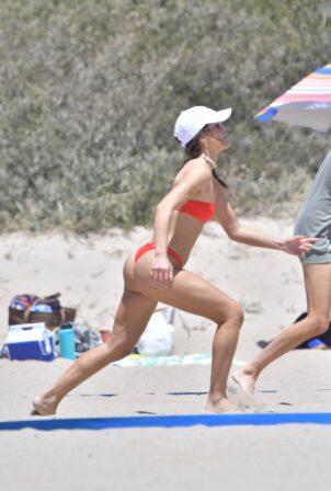 Camila Coelho - In red bikini plays beach volleyball in Santa Monica