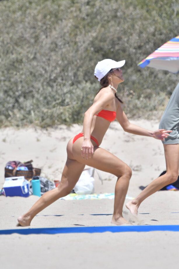 Camila Coelho - In red bikini plays beach volleyball in Santa Monica