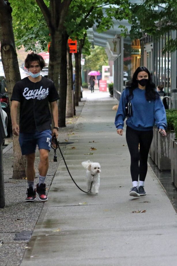 Camila Mendes - heads out with boyfriend Charles Melton for a rainy walk in Vancouver