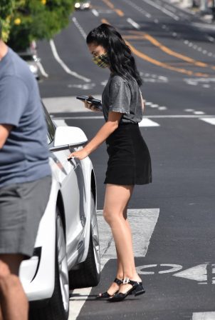 Camila Mendes - In a black denim mini skirt out for a coffee