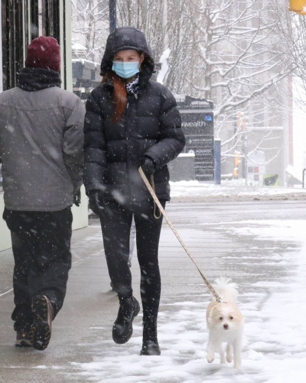 Camila Mendes - While walking dogs in a Vancouver snowstorm