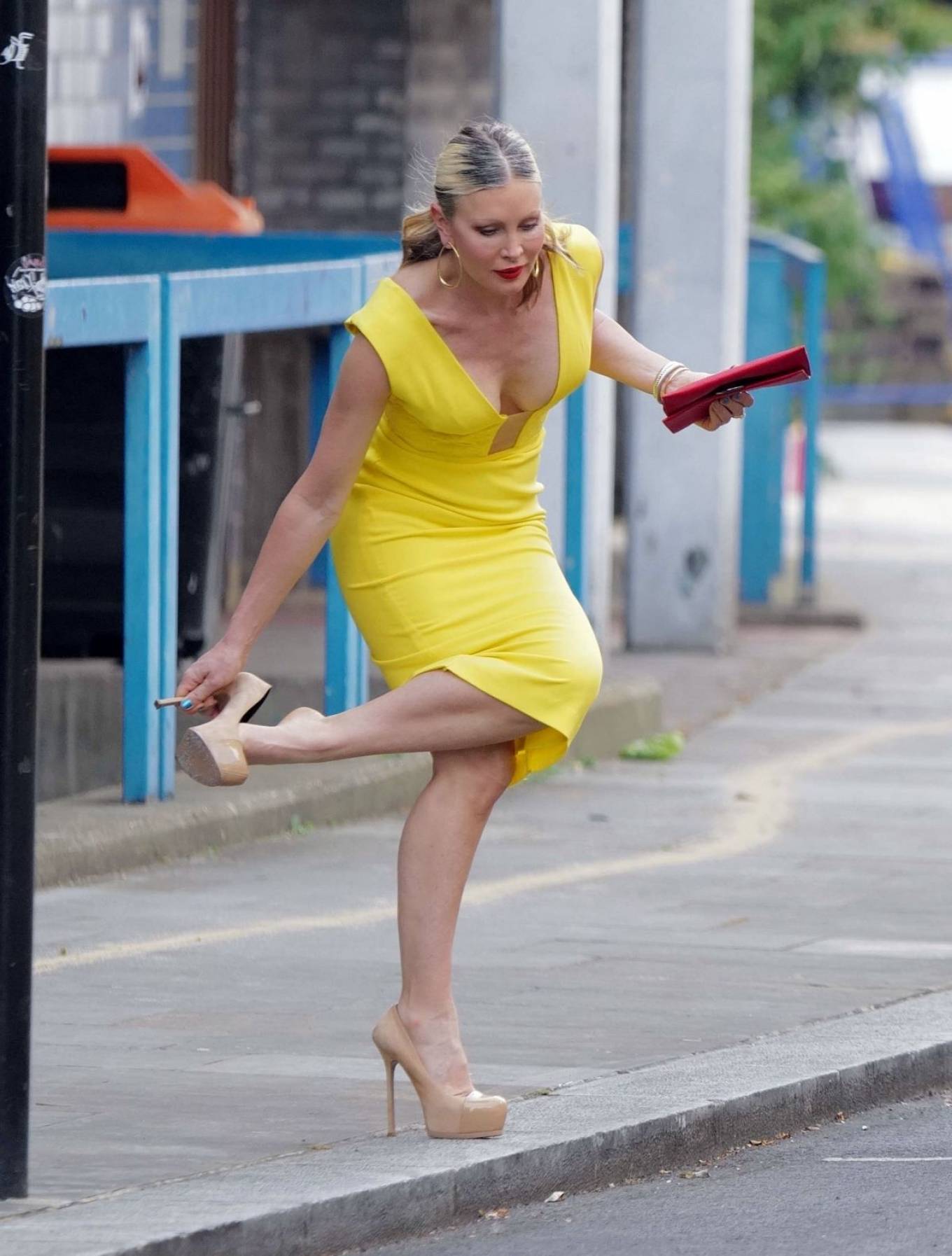 Caprice Bourret - Pictured in a tight yellow dress while out in London