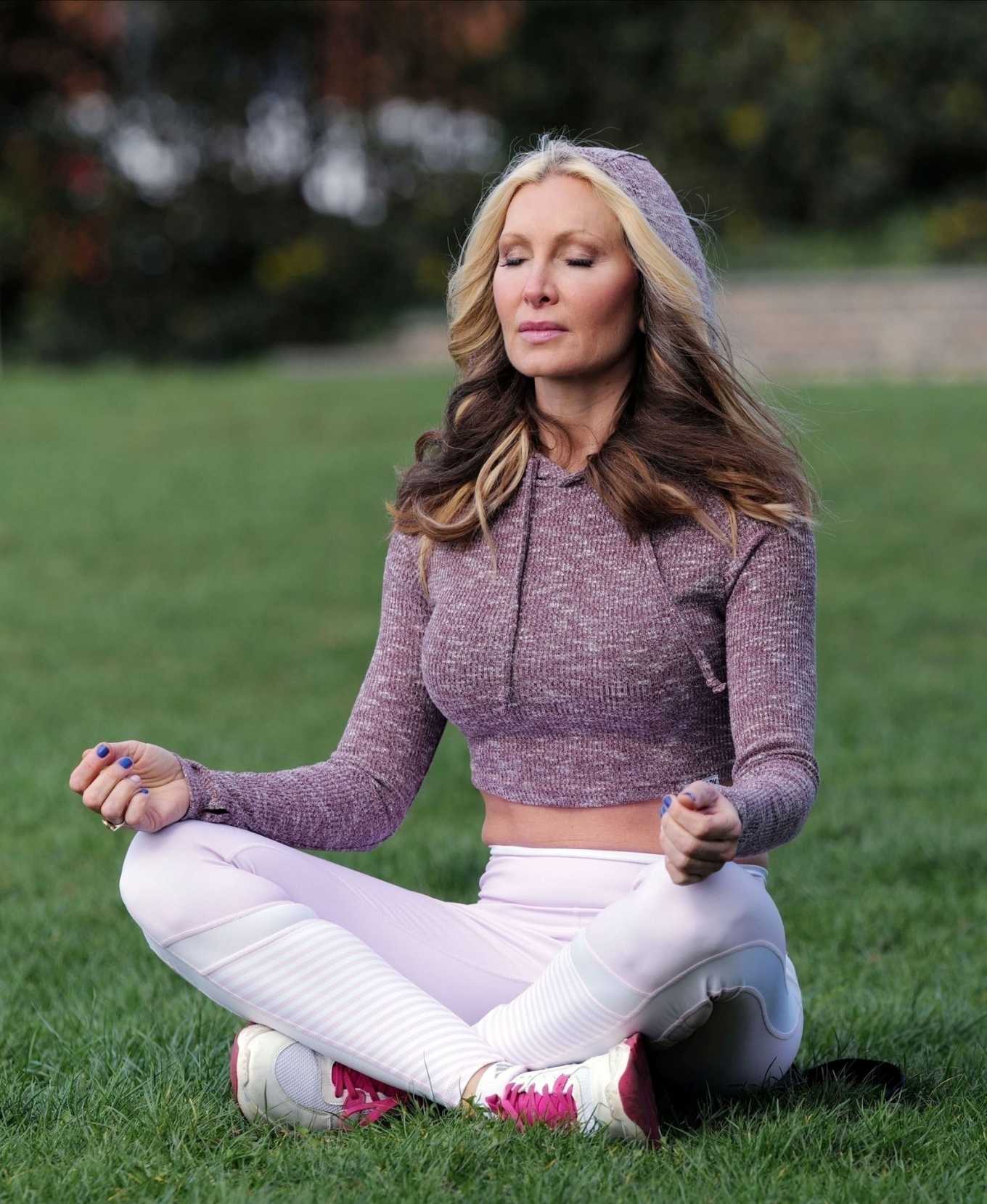Caprice Bourret â€“ Practicing Yoga in a park in London