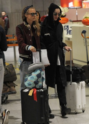 Cara Delevingne and girlfriend St Vincent at Charles de Gaulle Airport in Paris