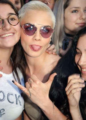 Cara Delevingne poses with fans in Paris
