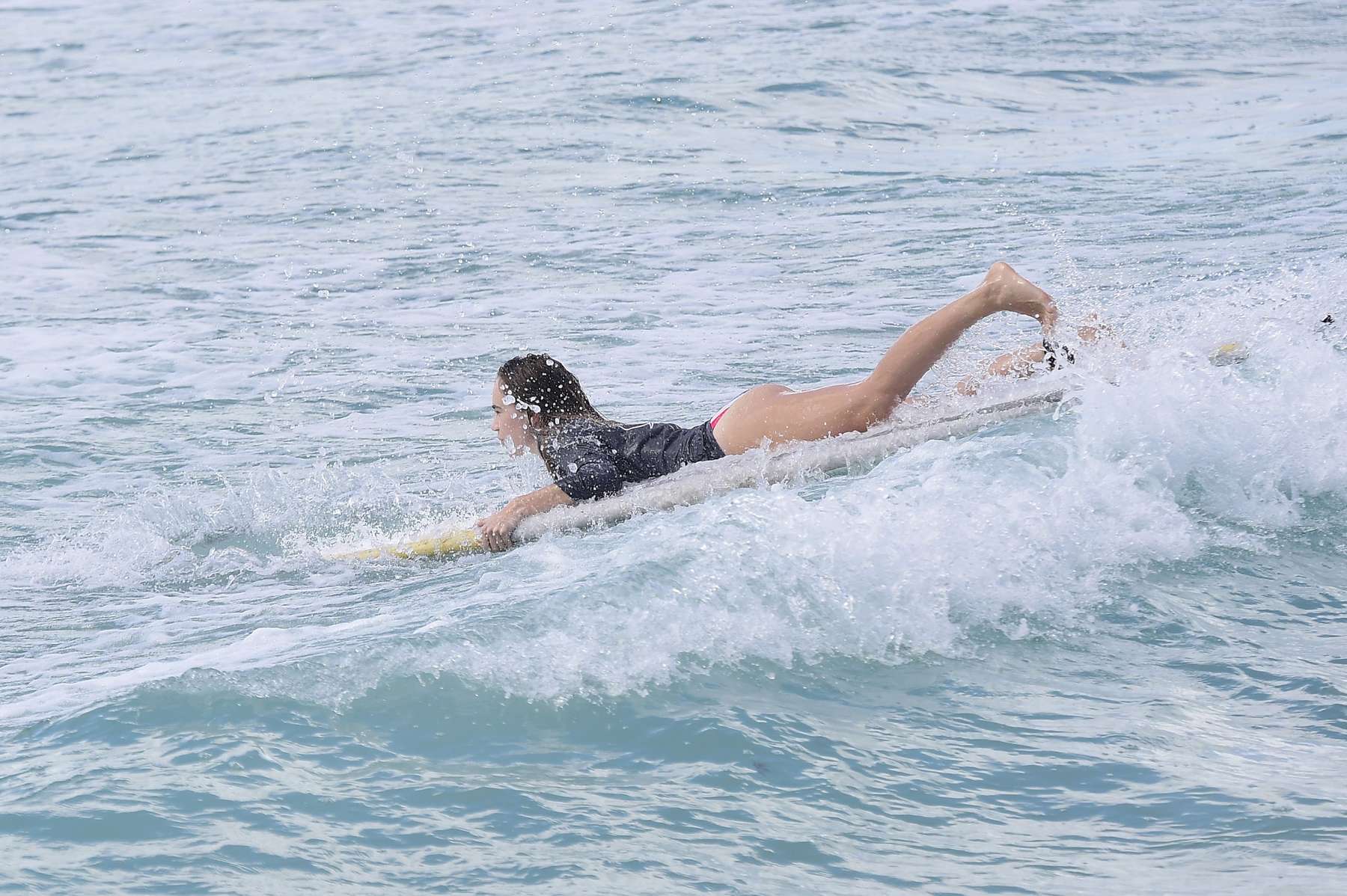 Cara Delevingne - Surfing in Barbados. 