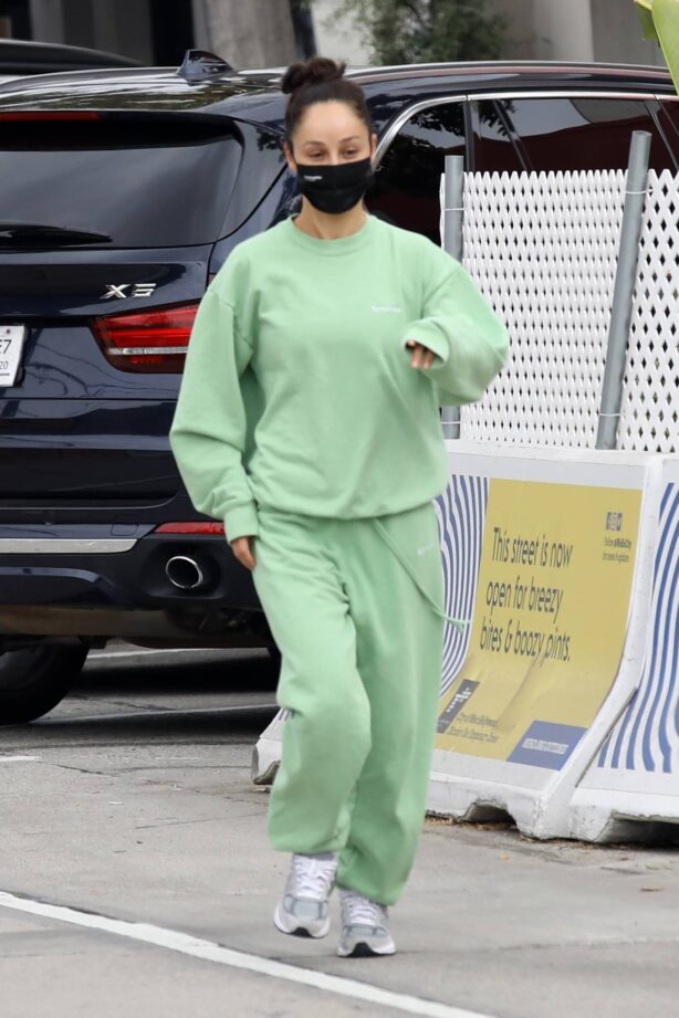 Cara Santana - In green tracksuit running errands in West Hollywood