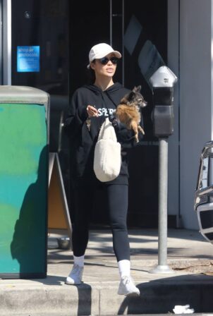 Cara Santana - runs errands with her dog in Los Angeles