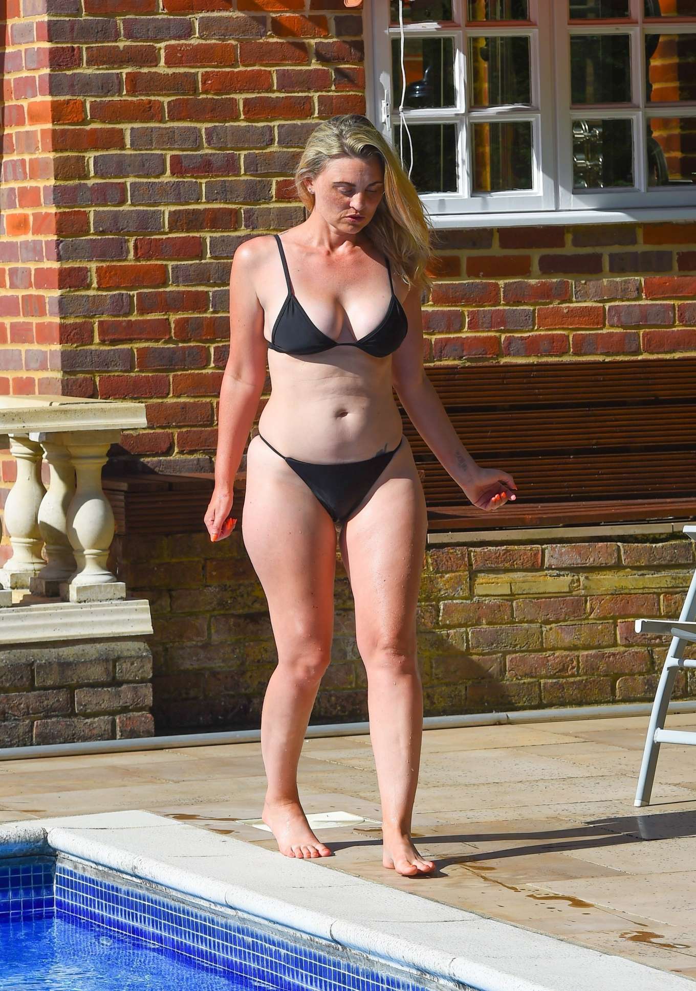 Carla Bellucci in Black Bikini at the pool in Marbella. 