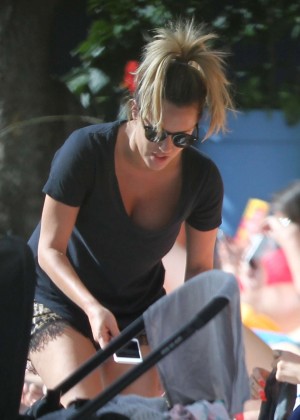 Caroline Flack - Relaxing at the pool in Miami Beach